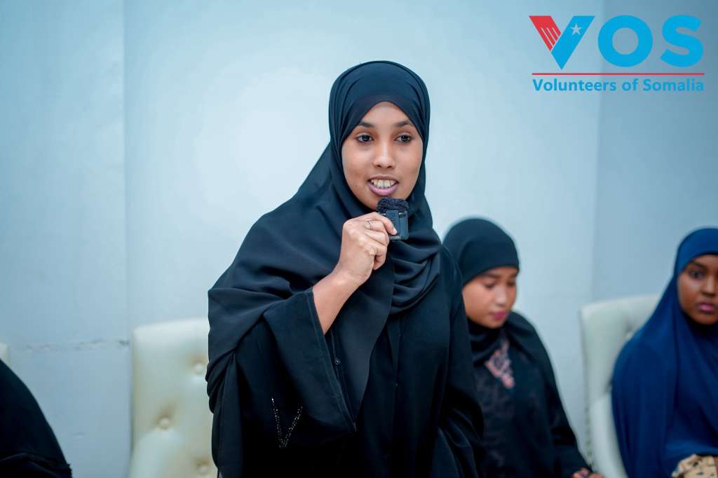 A woman speaking at a VOS community meeting